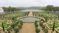 Scenic view of Gardens of Versailles Palace on a cloudy day in Paris, France