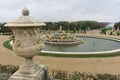 Scenic view of Latona Fountain in Gardens of Versailles at Paris, France under a cloudy sky