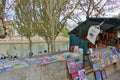 View of a Bouquiniste booth stall by the Seine river across from Notre Dame de Paris. The Bouquinistes