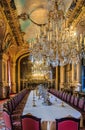 Banquet table in the apartments of Napoleon III in Louvre Museum in Paris, France with luxury baroque furnishings and stunning