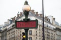 The famous parisian Metropolitan sign at the subway sation entry in the street