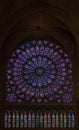 Closeup of stained glass of the oldest rose window installed in 1225 in the Notre Dame de Paris Cathedral in Paris France