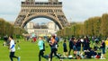 PARIS, FRANCE - OCTOBER 7, 2017. Crowded Champ de Mars lawn near the Eiffel tower base on a sunny day