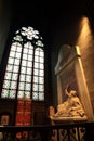 Paris, France - October 28, 2018: Interior of Notre Dame de Paris. Small altar with ancient statue of saint and stained glass Royalty Free Stock Photo