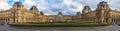 Panoramic view of the facade of the famous Louvre Museum, one of the world`s largest art museums and a historic monument in Paris