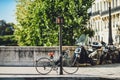 Parked bicycle and motorbikes in the Paris center, France