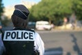 A police officer on duty near au Change bridge on the Seine River