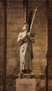 Statue of Joan of Arc or Jeanne d'Arc, national heroine of France, at the Notre Dame de Paris Cathedral in Paris France Royalty Free Stock Photo