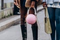 Paris, France - October, 3, 2021: woman wears handbag Hermes Fgm Bag Nike pink basketball leather shoulder bag,