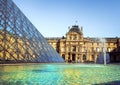 Paris / France -09/19/2009: Paris Louvre Museum: pyramid and Louvre buildings and tourists. T