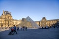 Paris / France -09/19/2009: Paris Louvre Museum: pyramid and Louvre buildings and tourists. T