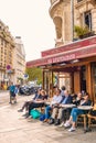 Paris France people drinking coffee on the terrace of a cafe restaurant during the Autumn Royalty Free Stock Photo