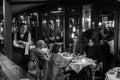 People in open veranda of Fouquet`s Paris is a historic high-end brasserie in Paris, France. It is located at 99 Champs Elysees