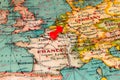 Paris, France pinned on vintage map of Europe