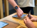 Apple Store first day of sale for new titanium Apple Watch Ultra on male hand - Royalty Free Stock Photo