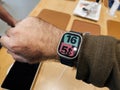 Colorful watch face on male hand testint in Apple Store first day of sale for Royalty Free Stock Photo