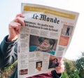 Woman reading le Monde French press Angela Merkel elections Germ Royalty Free Stock Photo