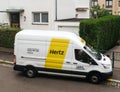White HERTZ rent a van service seen from above on a French stree