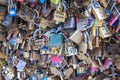 Colorful Love locks collection with messages closeup hanging on the Pont des Arts in Paris