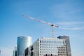 Paris, France - September 29, 2017: construction crane over skyscrapers. Building construction in La Defense. Modern