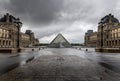 Louvre museum in black and white with reflection in a puddle. Louvre museum is one of the world`s largest museums with more than Royalty Free Stock Photo