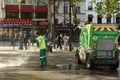 Paris, France - September 2, 2019: A municipal worker washes the sidewalk in Paris