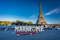 Paris, France - September 17, 2022: The romantic scenery of a marriage proposal with the inscription marry me in front of the