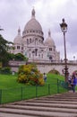 Sacre Coeur touristic attraction and many people outdoors