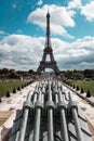 Photo of the Eiffel Tour with cannons from ground level perspective