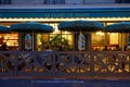 Typical Parisian restaurant La Dame de Paris at night located next to famous Notre Dame cathedral Paris, France.