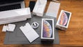 Man unboxing iPhone Xs Max Xr with all accessories