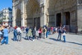 Tourists are at famous Notre Dame de Paris, France Royalty Free Stock Photo