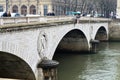 Paris, France 03.25.2017: Stone bridges over the river Seine in Paris Royalty Free Stock Photo