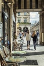 Paris, France, 09/10/2019: street cafe and walking people. Vertical Royalty Free Stock Photo