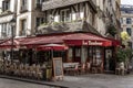 Paris, France, 10/10/2019: Street city cafe with people relaxing and working online. Toning