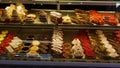 Sweet delicious traditional French pastry in several variations presented in a confectionery shop in the historic center.