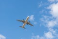 Paris, France - 08 08 2023: White and gray plane with chassis is landing on the landscape background Royalty Free Stock Photo