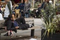 homeless man resting on a bench