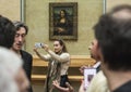 PARIS - May 5: A woman taking selfie at the Louvre