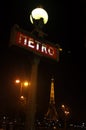 Paris metro and Eiffel Tower at night Royalty Free Stock Photo