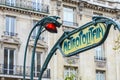 Paris Metropolitain entrance station. A pole with traditional me