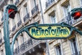 Paris Metropolitain entrance station. A pole with traditional me