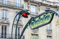 Paris Metropolitain entrance station. A pole with traditional me