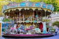 Empty two story nostalgic old antique children carousel with traditional horses