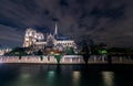 Paris Notre Dame cathedral by night from Seine river Royalty Free Stock Photo