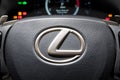 Lexus logo on the steering wheel of a modern Lexus car at the Paris Motor Show