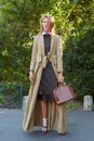 Samantha Angelo poses wearing a Dries Van Noten coat before Chloe show, Paris Fashion Week Day 3 Royalty Free Stock Photo