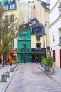 Street view on ancient historical green, blue buildings with famous old vintage Odette patisserie