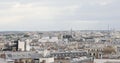 Paris rooftops view and Eiffel Tower, pan view in a cloudy day in France