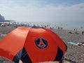 Paris Saint-Germain sun umbrella on beach in Le TrÃÂ©port, France